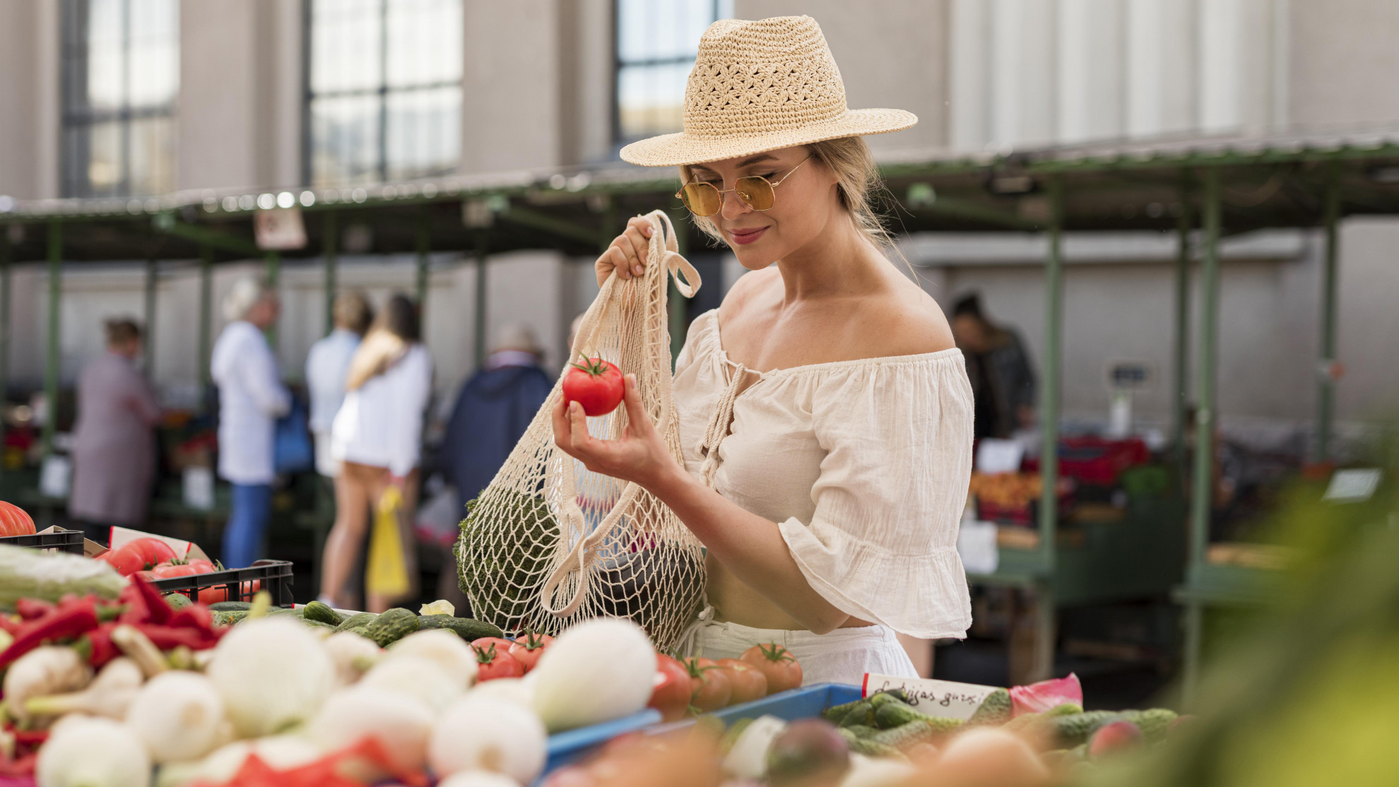 medium-shot-woman-using-organic-bag-for-veggies