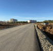 На новой дороге в центре города уложен слой асфальта 